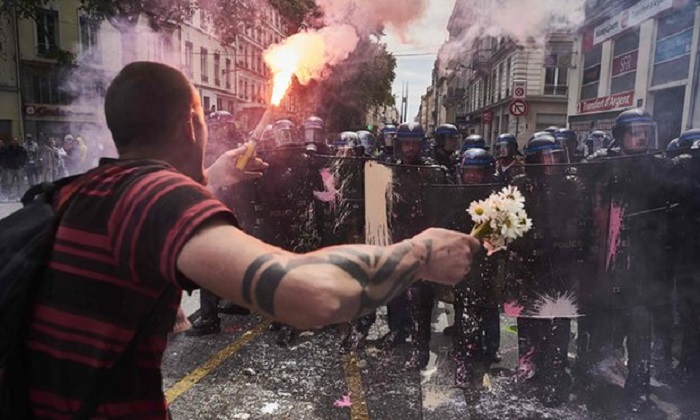Riot police crack down on Paris protests against labour reforms